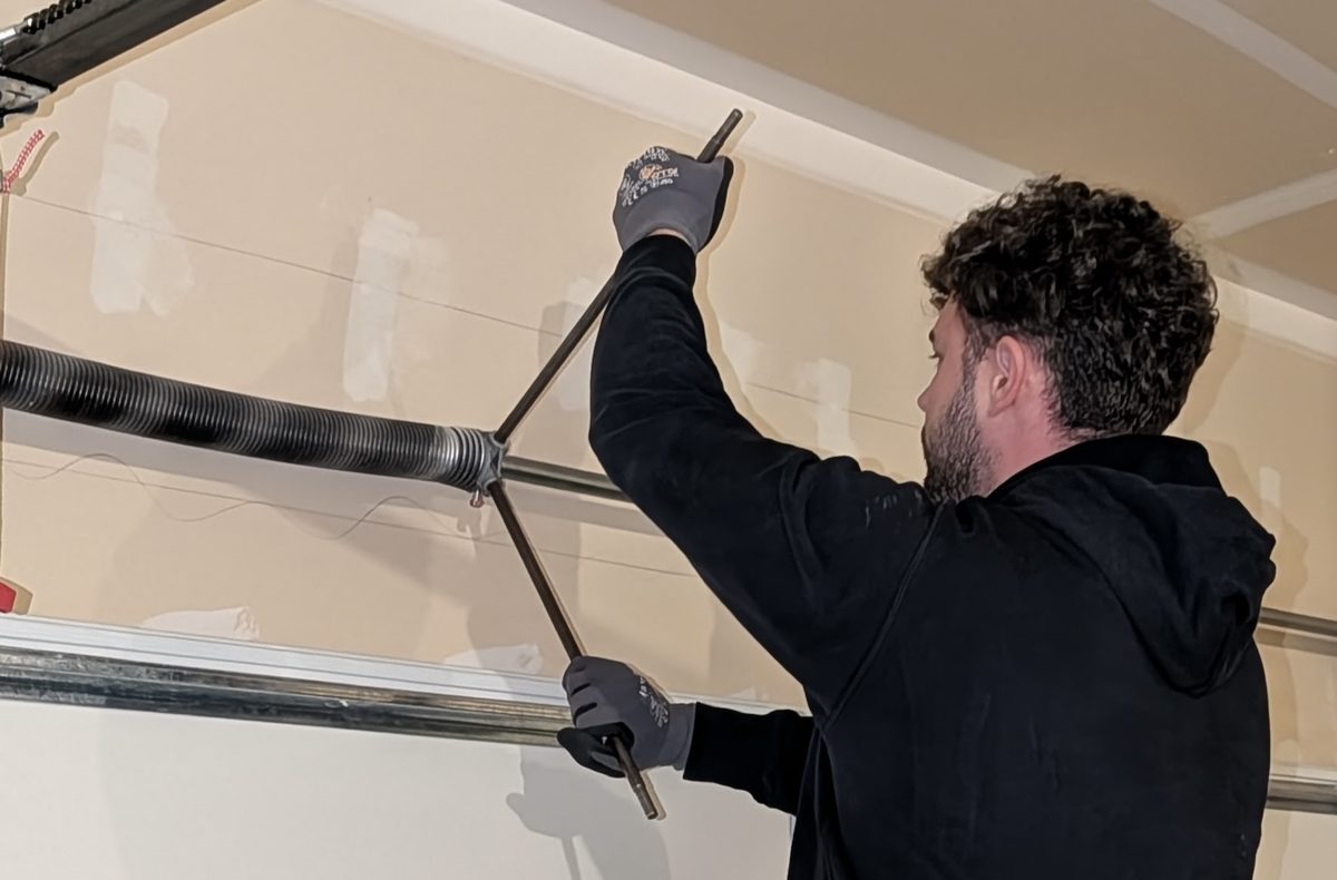 Torsion spring adjustment on a garage door